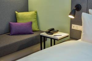 Vuode tai vuoteita majoituspaikassa H+ Hotel Wien