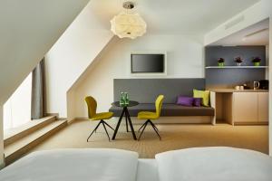 TV tai viihdekeskus majoituspaikassa H+ Hotel Wien