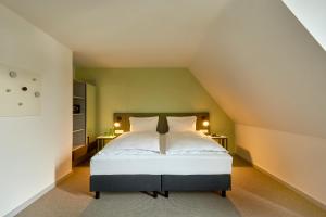 Vuode tai vuoteita majoituspaikassa H+ Hotel Wien