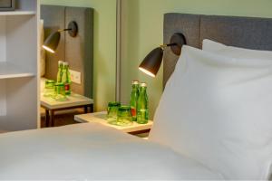 Vuode tai vuoteita majoituspaikassa H+ Hotel Wien
