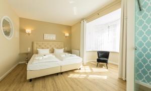 Postel nebo postele na pokoji v ubytování SATAMA Sauna Resort & SPA