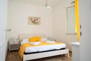Posteľ alebo postele v izbe v ubytovaní Baglio Reale Apartments