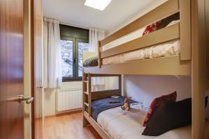 Ein Bett oder Betten in einem Zimmer der Unterkunft Pierre & Vacances Andorra El Tarter