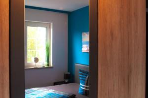 Postel nebo postele na pokoji v ubytování Ferienwohnung Nickmann im Scheffelhof