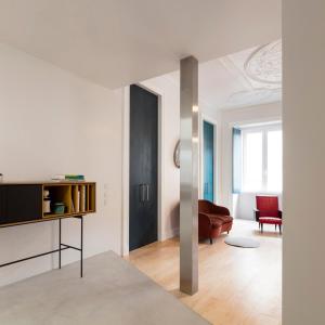 a living room with a couch and a table at Awarded 3 bedrooms upscale flat@Chiado Bairro Alto in Lisbon