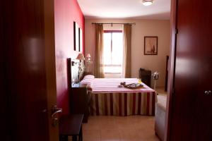 Voodi või voodid majutusasutuse Hotel Rocio toas
