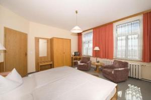 Postel nebo postele na pokoji v ubytování Panoramahotel Wolfsberg