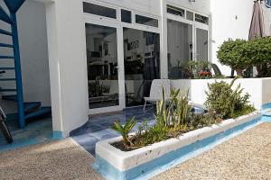 a patio with tables and chairs in front of a building at Vanessa Puerto del Carmen in Tías