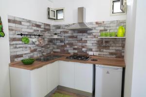 Kuchyňa alebo kuchynka v ubytovaní Baglio Reale Apartments