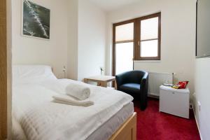 Katil atau katil-katil dalam bilik di Hotel Ungar