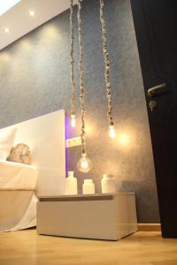 Postel nebo postele na pokoji v ubytování Maxela Apartments