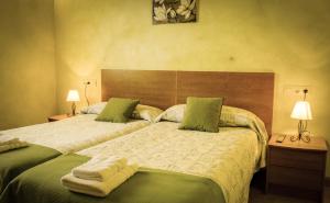 A bed or beds in a room at Casa de aldea Collera