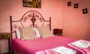 A bed or beds in a room at Casa de aldea Collera
