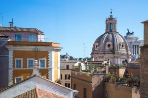 a view of the roofs of buildings in a city at Rent in Rome - IV Novembre in Rome