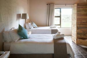 Postel nebo postele na pokoji v ubytování Witfontein Game Lodge