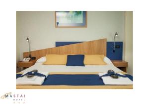 Postel nebo postele na pokoji v ubytování Hotel Mastai