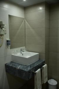Ett badrum på Hotel Anjos