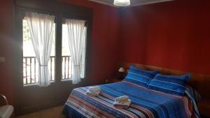 A bed or beds in a room at Casa de aldea Collera