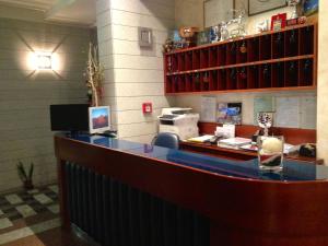 a bar in a restaurant with a blue counter at Hotel Ristorante Anita in Cupra Marittima