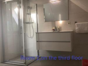 a bathroom with a shower and a sink at B&B nancy in holland met eigen badkamer , independent bathroom in Aalten +36 photos