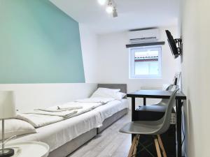 Ένα ή περισσότερα κρεβάτια σε δωμάτιο στο Chesscom Guesthouse