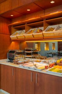 a buffet line with many different types of food at Hotel Dom Carlos Liberty in Lisbon