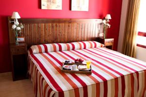 
Cama o camas de una habitación en Hotel Rocio

