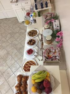 a table topped with lots of different types of food at Palazzo Reginella in Bovalino Marina