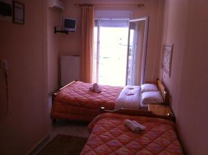 Säng eller sängar i ett rum på Hotel Avra