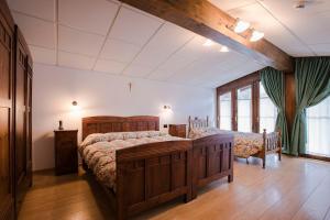 Ένα ή περισσότερα κρεβάτια σε δωμάτιο στο GH Hotel Fratazza