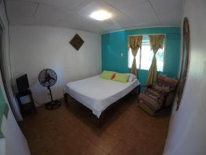 Postel nebo postele na pokoji v ubytování Cabinas Palmer Makanda