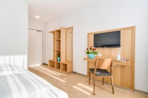 TV a/nebo společenská místnost v ubytování Hotel-Etage Apfelrot