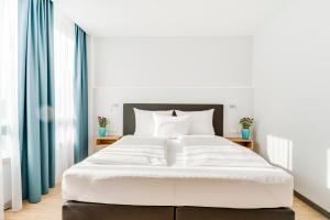 Postel nebo postele na pokoji v ubytování Hotel-Etage Apfelrot