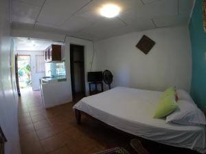 Postel nebo postele na pokoji v ubytování Cabinas Palmer Makanda
