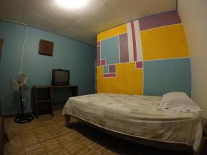 Postel nebo postele na pokoji v ubytování Cabinas Palmer Makanda