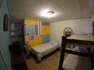 Postel nebo postele na pokoji v ubytování Cabinas Palmer Makanda