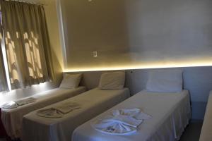 Cama ou camas em um quarto em Hotel Ipiranga Maringa