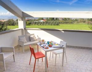 En balkon eller terrasse på Villa Ulivi B&B