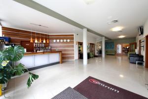 a lobby with a bar in a building at Hotel S-centrum in Benešov