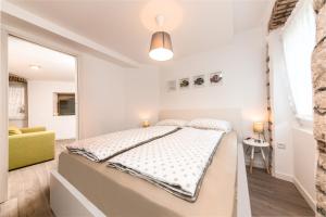 Postel nebo postele na pokoji v ubytování Mariva Downtown apartment with free parking