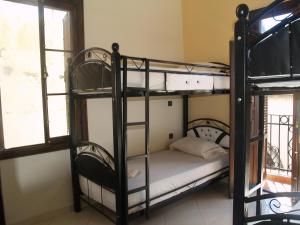 Uma cama ou camas num quarto em TanjaLucia Hostel