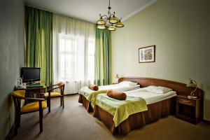 Кровать или кровати в номере Шелфорт Отель