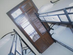 Uma cama ou camas num quarto em TanjaLucia Hostel