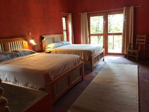 En eller flere senge i et værelse på Morrillo Beach Eco Resort