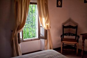 A bed or beds in a room at Casa Rural La Maquinilla