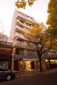 a building with a car parked in front of it at Rosedal Suite in Buenos Aires