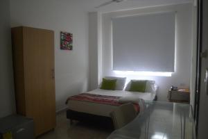 Cama o camas de una habitación en Hotel Calarca Plus