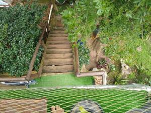 a set of stairs in a garden with plants at Hostel do Morro in Florianópolis