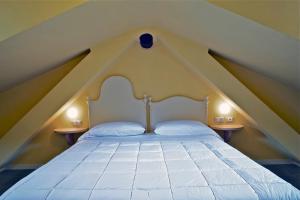 Postel nebo postele na pokoji v ubytování Locanda della Maria