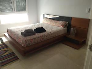 מיטה או מיטות בחדר ב-centro / internet / parking / aire acondicionado